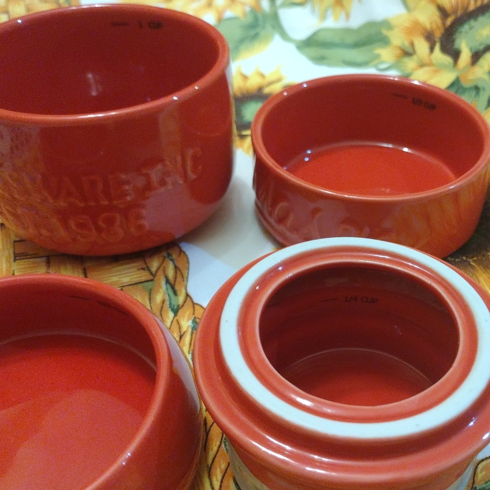 Stackable Red ceramic measuring cups designed to resemble a mason jar